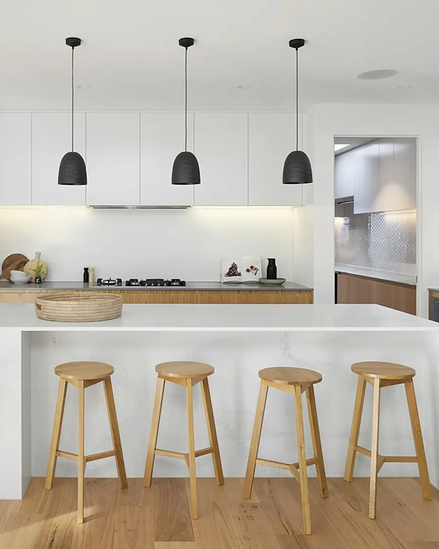Handleless kitchen with oak cabinetry and white worktops