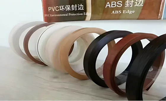 Rolls of edge banding in white, woodgrain and black finishes