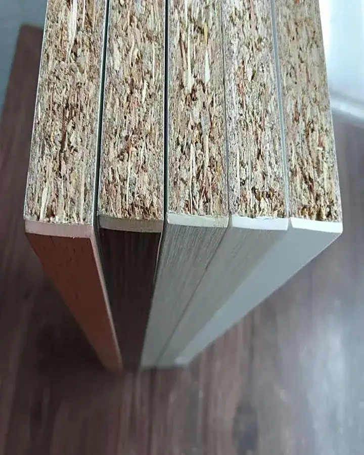 Close-up of edge banding bonded to a board, showing a flush, clean edge line