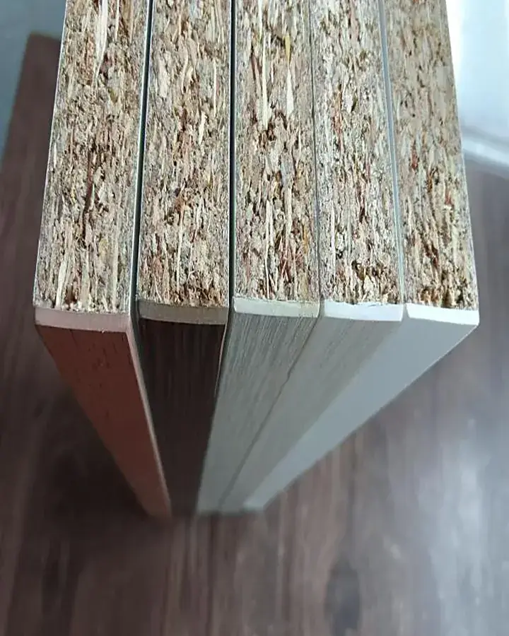 Edge banding profile sample held against a board to check fit